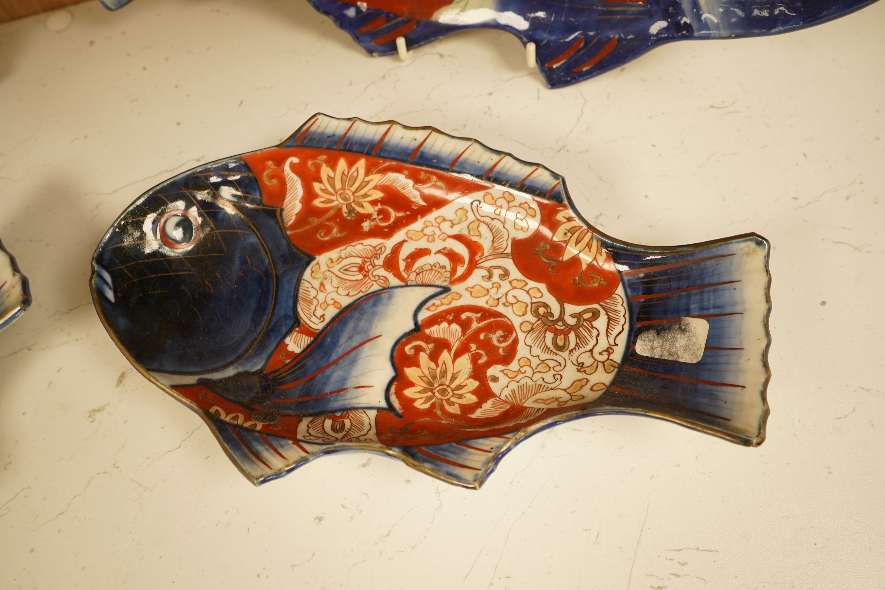 Four Japanese Imari fish-shaped dishes, largest 32cm wide